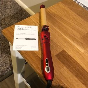 BRAND new Chi ARC rotating curling iron